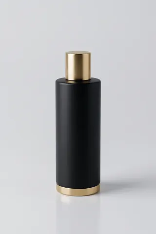 Tall matte-black cylindrical bottle with a brushed gold cap